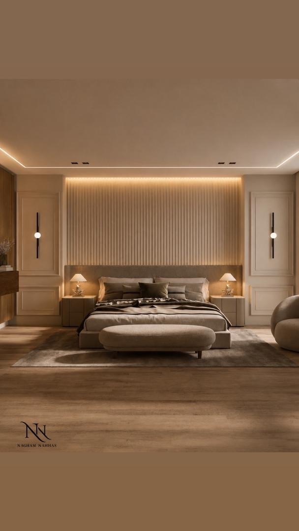 Master bedroom with a fluted headboard wall lit from behind and a long upholstered bench